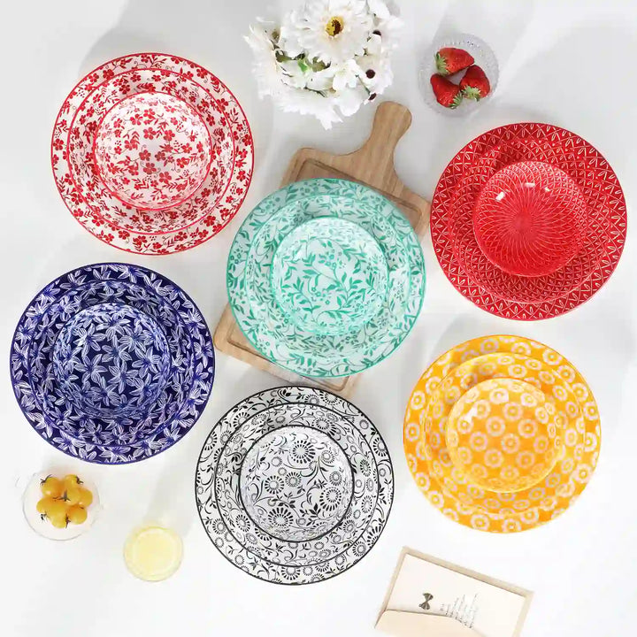 Selene 24 Piece Vibrant Porcelain Dinnerware Set Zen Floral Pattern Minimalist White Table Setting.