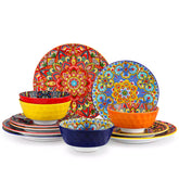 Bohemian Lumi 12 piece porcelain dinnerware set with vibrant patterned plates diamond embossed bowls served with steak eggs and fresh fruit on a wooden table