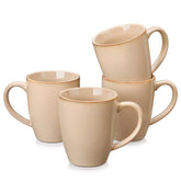 Playa 16oz stoneware mugs in brown reactive glaze on a rustic wooden surface for a cozy morning pour with coffee carafe and scattered beans