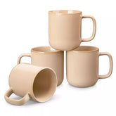 Playa 12oz stoneware mugs in glossy brown reactive glaze on a rustic wooden table for a cozy breakfast with fresh coffee pastries and berries