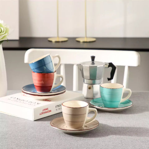 Steaming coffee served in colorful spiral stoneware cups and saucers-handmade vintage design - B
