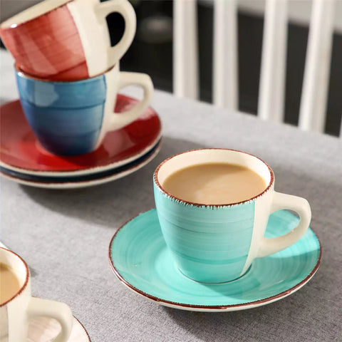 Steaming coffee served in colorful spiral stoneware cups and saucers-handmade vintage design - B