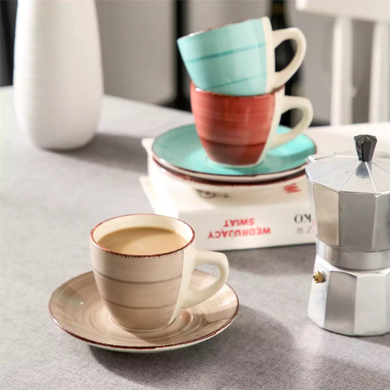 Steaming coffee served in colorful spiral stoneware cups and saucers-handmade vintage design - B