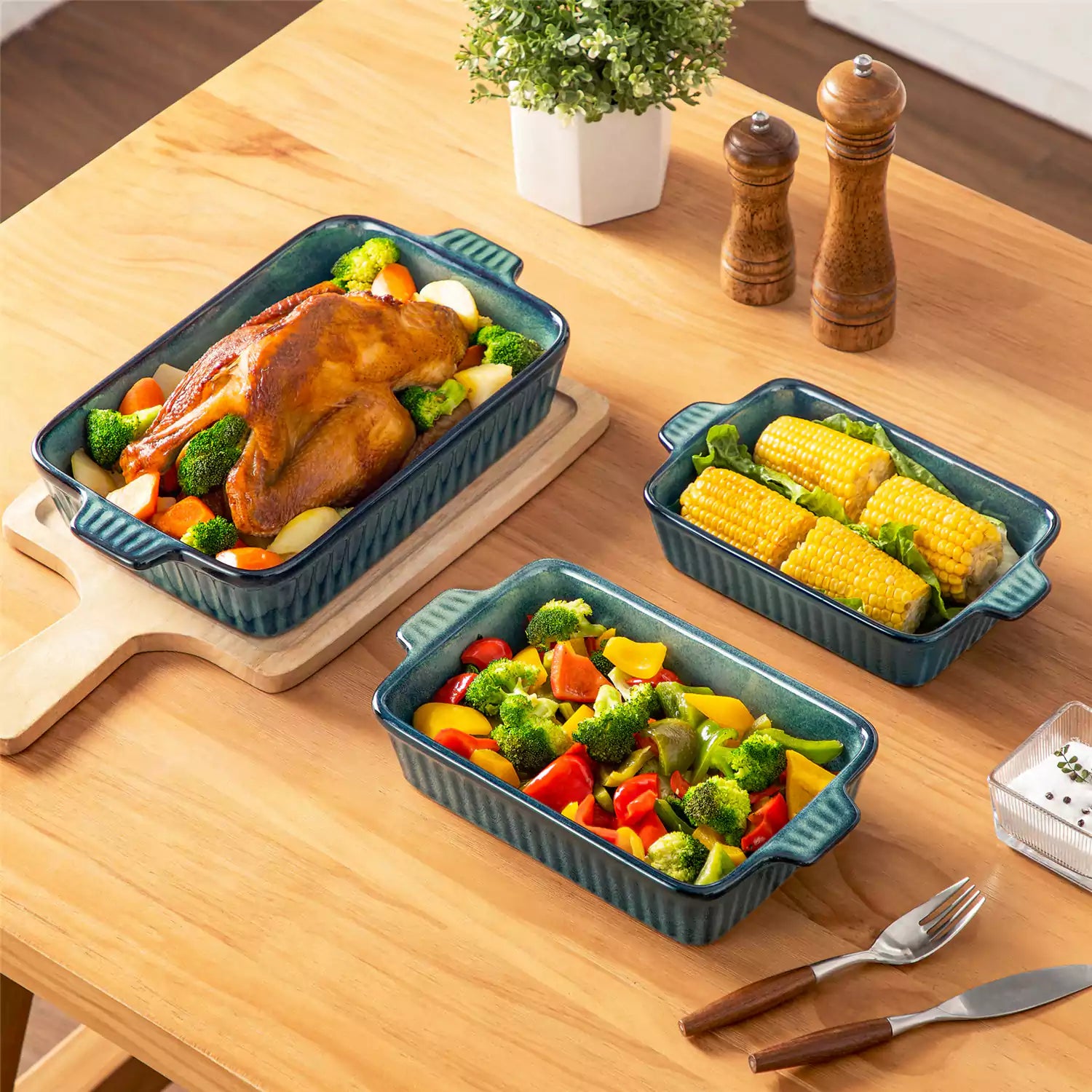 Starry 3 piece stoneware bakeware set with reactive glaze in green on a wooden table