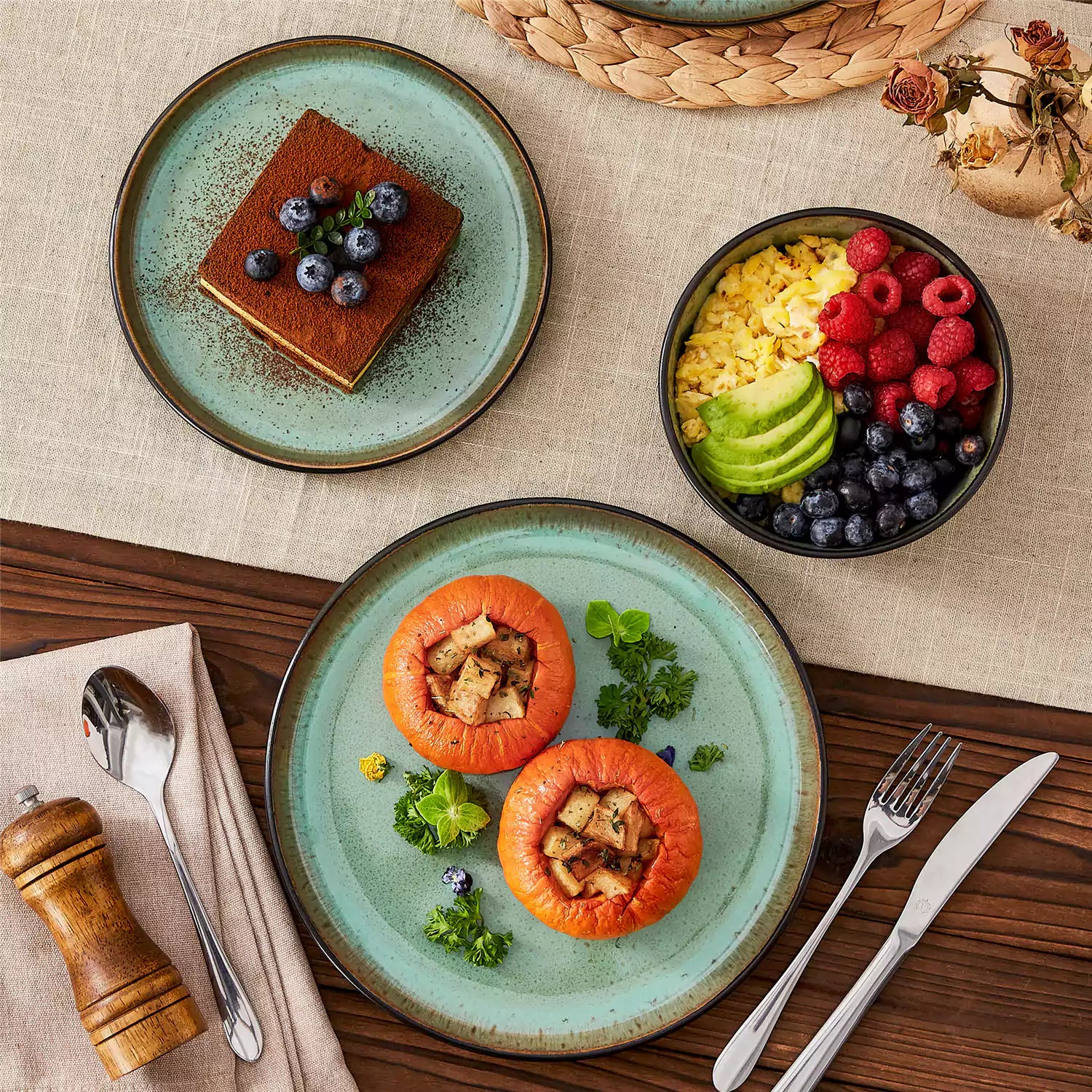 Rustic dining table with Amber 12-piece stoneware dinnerware in farmhouse green - featuring reactive glaze plates - bowls - and utensils by vancasso