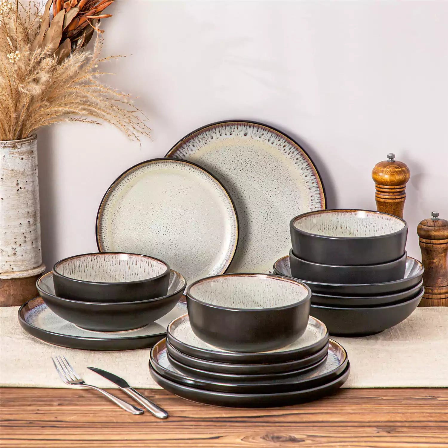 Assorted dishes with soup - dessert - and fruit salad on rustic wooden table - Amber 16-Piece beige stoneware dinnerware set with plates and bowls by vancasso