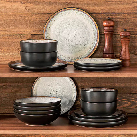 Assorted dishes with soup - dessert - and fruit salad on rustic wooden table - Amber 16-Piece beige stoneware dinnerware set with plates and bowls by vancasso