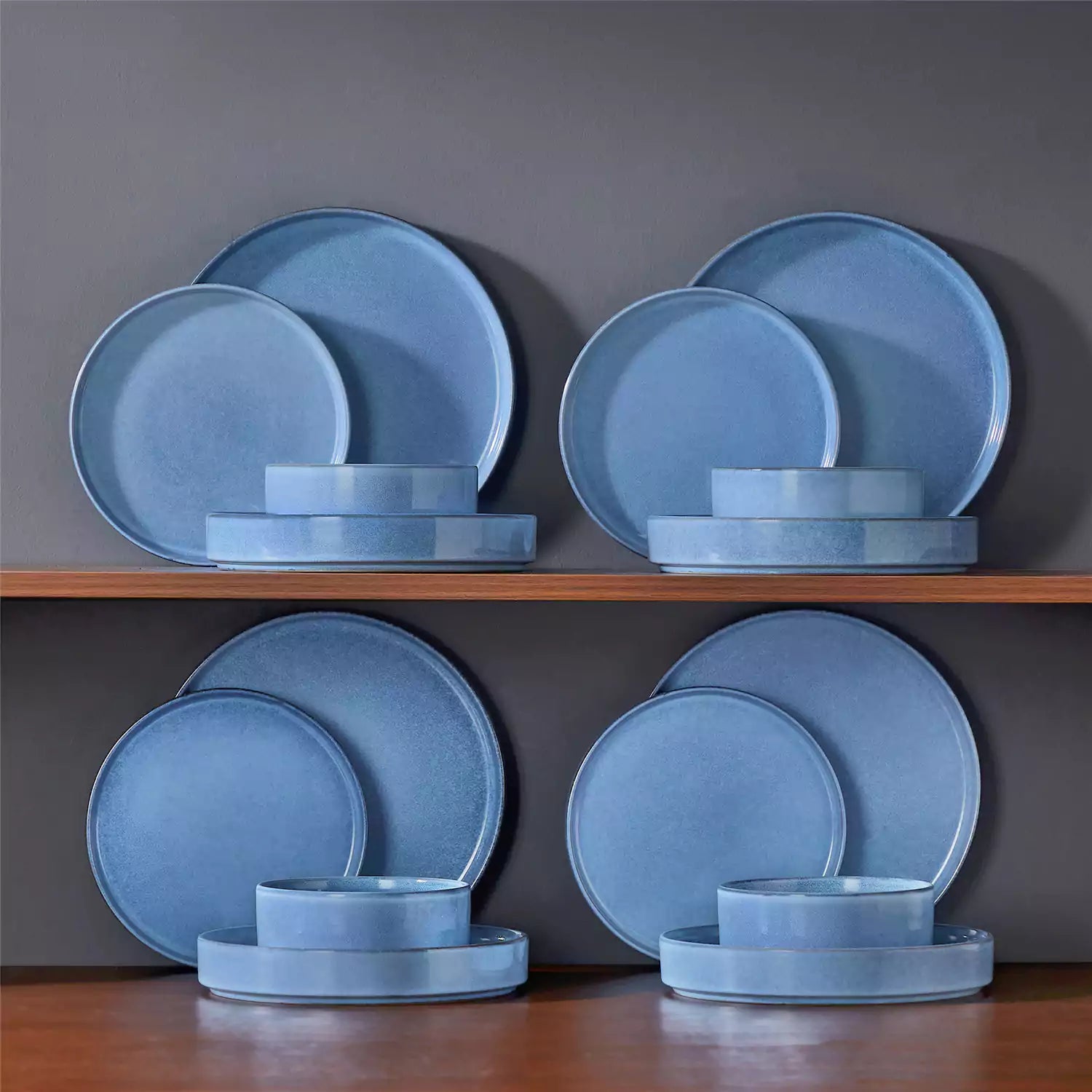 Anya 16 piece straight edge stoneware dinner set in blue with pasta soup and pastries on a modern farmhouse table