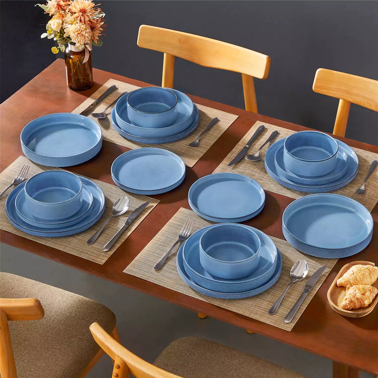 Anya 16 piece straight edge stoneware dinner set in blue with pasta soup and pastries on a modern farmhouse table