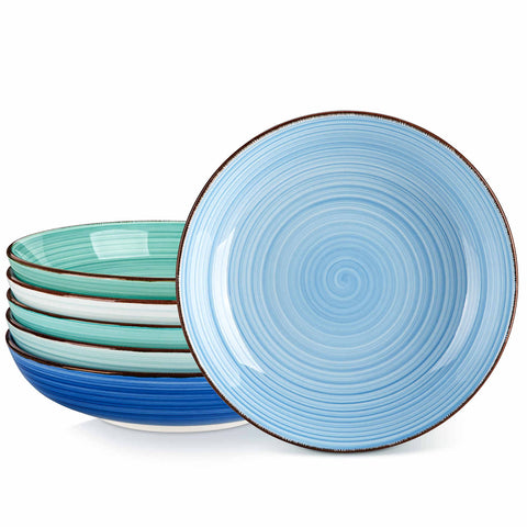 Blue Bonita large stoneware bowls set of 6 on a white table - each filled with pasta - pumpkin soup - and fruit salad - creating a bright and inviting table setting