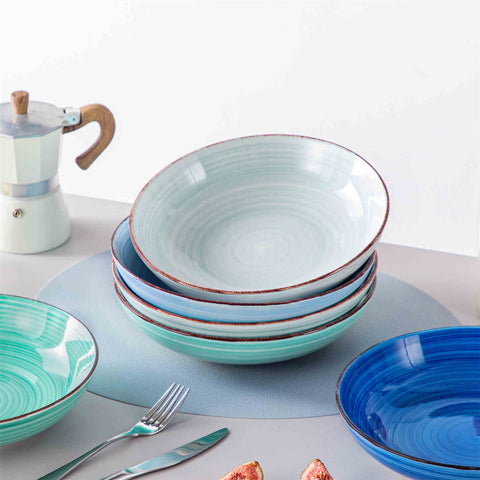 Blue Bonita large stoneware bowls set of 6 on a white table - each filled with pasta - pumpkin soup - and fruit salad - creating a bright and inviting table setting