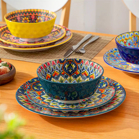 Bohemian Lumi porcelain dinnerware set for 6 with vibrant patterned plates diamond-embossed bowls served with fresh food bread and olive oil on wooden table
