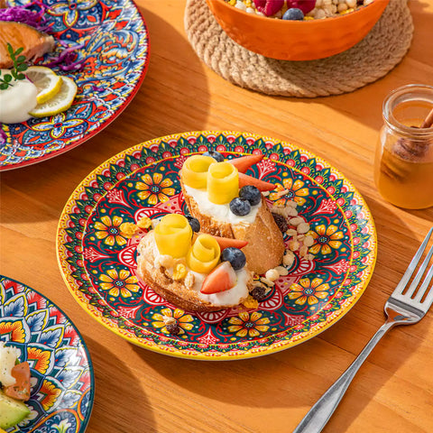 Bohemian Lumi porcelain dinnerware set for 6 with vibrant patterned plates diamond-embossed bowls served with fresh food bread and olive oil on wooden table