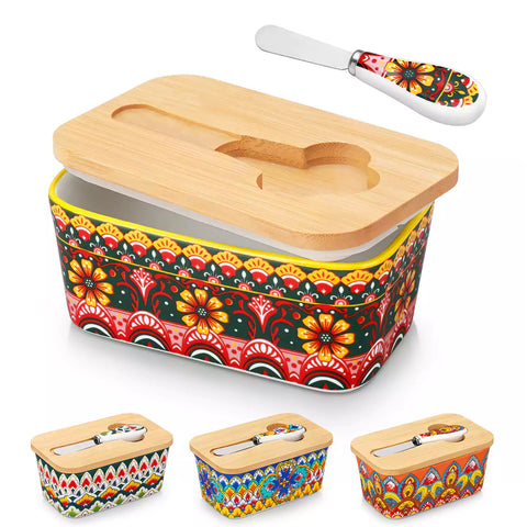 Lumi lemon yellow porcelain butter dish with lid in vibrant Bohemian pattern on a wooden table