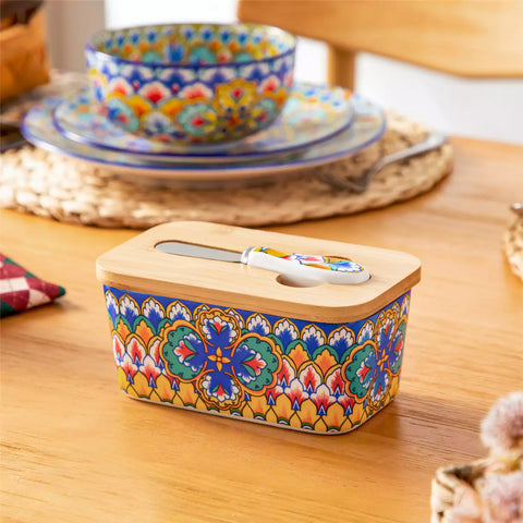 Lumi vibrant blue porcelain butter dish with lid in vibrant Bohemian pattern on a wooden table