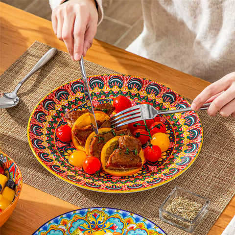 Bohemian Lumi 12 piece porcelain dinnerware set with vibrant patterned plates diamond embossed bowls served with steak eggs and fresh fruit on a wooden table