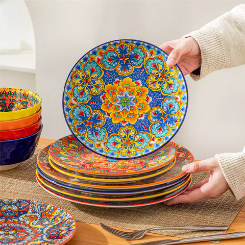 Bohemian Lumi 12 piece porcelain dinnerware set with vibrant patterned plates diamond embossed bowls served with steak eggs and fresh fruit on a wooden table