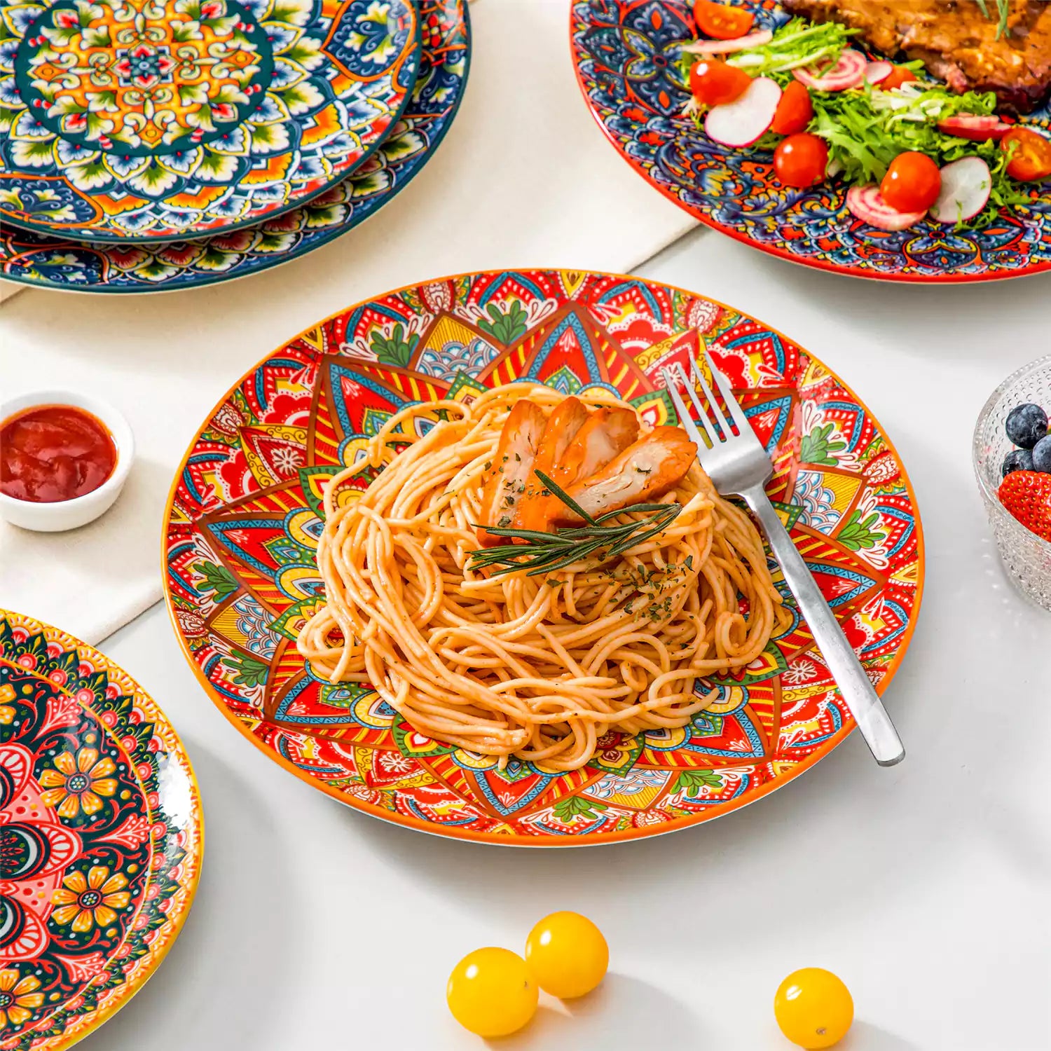Lumi 6-piece 10.5'' Bohemian dinner plates with colorful mandala patterns on a white table with fruit and cutlery