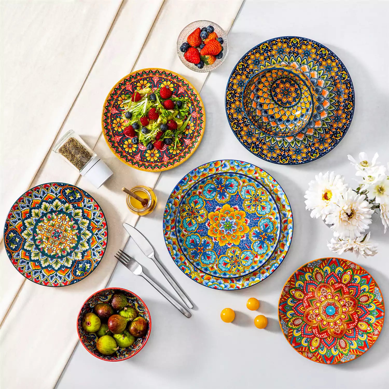 Lumi 6-piece 10.5'' Bohemian dinner plates with colorful mandala patterns on a white table with fruit and cutlery