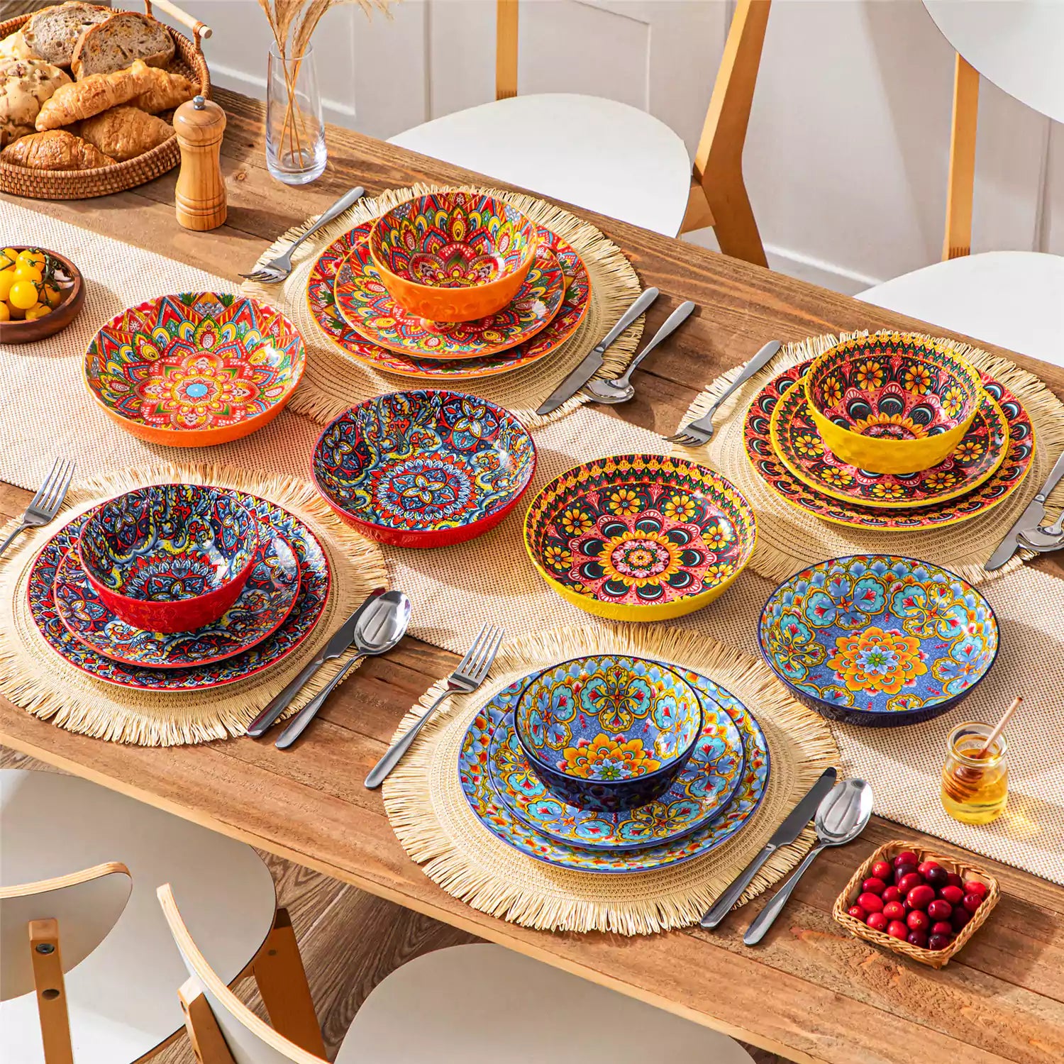 Bohemian Lumi 16 piece porcelain dinnerware set with colorful patterned plates and diamond-embossed bowls on a wooden table with assorted food and cutlery