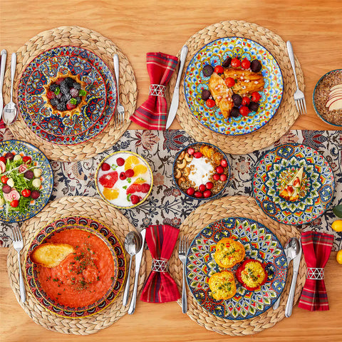 Bohemian style dining table set with Lumi 24 piece colorful dinnerware bowls and vibrant table décor ready for a lively meal