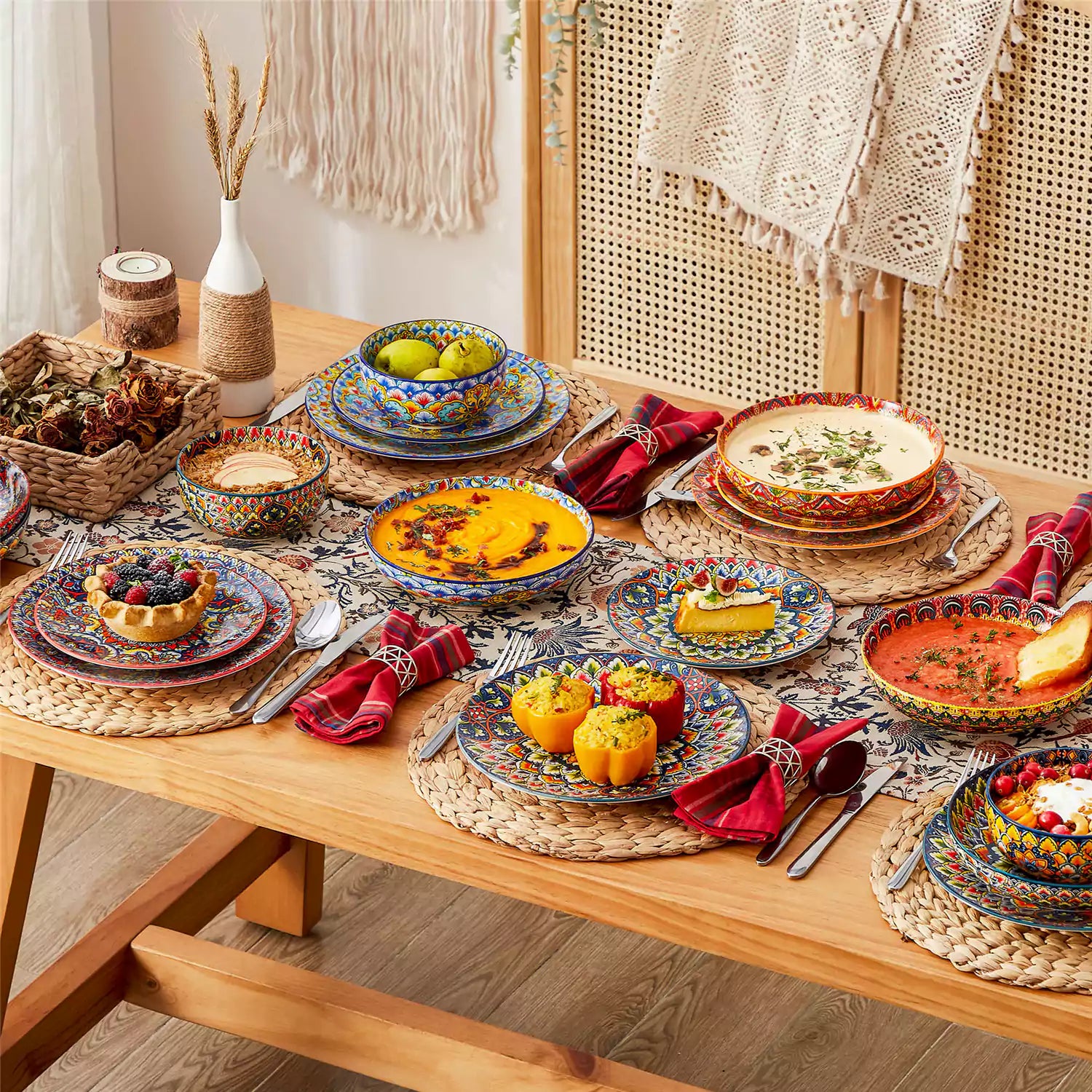 Bohemian style dining table set with Lumi 24 piece colorful dinnerware bowls and vibrant table décor ready for a lively meal