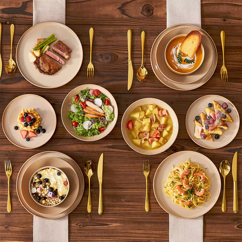 Assorted family dinnerware on wooden table brown stoneware soup bowl pasta with shrimp fruit tart and bread perfect for everyday meals