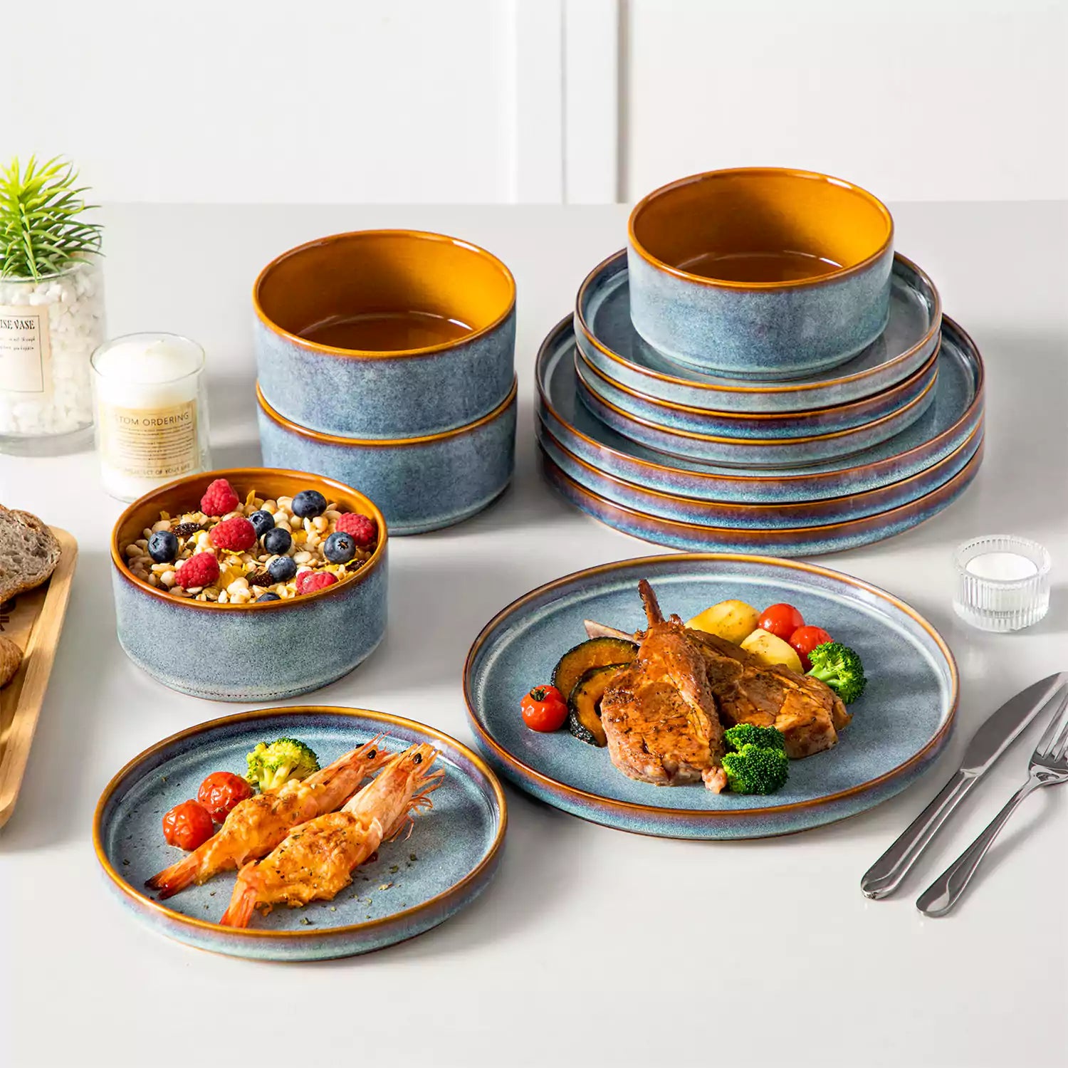 A rustic breakfast spread featuring a plate of meat with vegetables - waffles topped with fruit - and assorted pastries on a white table - complemented by blue stoneware dinnerware
