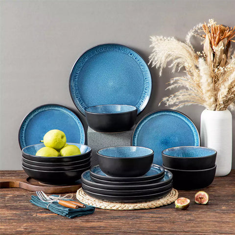 A glossy blue 16-piece stoneware dinnerware set from the Playa collection - featuring farmhouse charm with plates and bowls for 4 people-vancasso