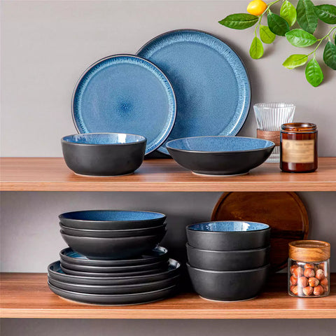 A glossy blue 16-piece stoneware dinnerware set from the Playa collection - featuring farmhouse charm with plates and bowls for 4 people-vancasso