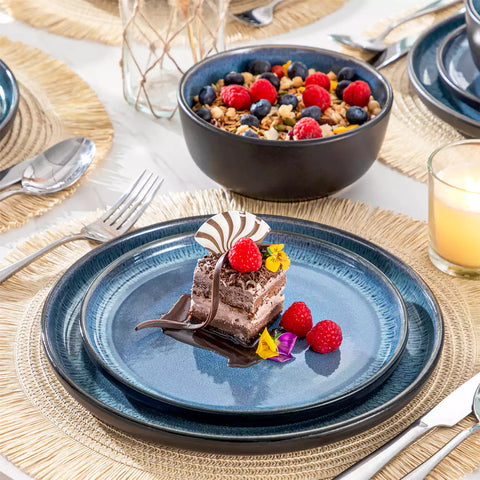 Playa 18-Piece Stoneware Dinnerware Set with plates and bowls for 6 - featuring a unique blue reactive glaze and a farmhouse-inspired style-vancasso