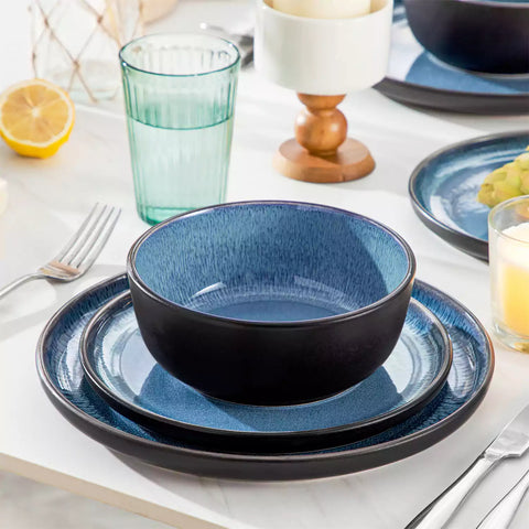 Playa 18-Piece Stoneware Dinnerware Set with plates and bowls for 6 - featuring a unique blue reactive glaze and a farmhouse-inspired style-vancasso