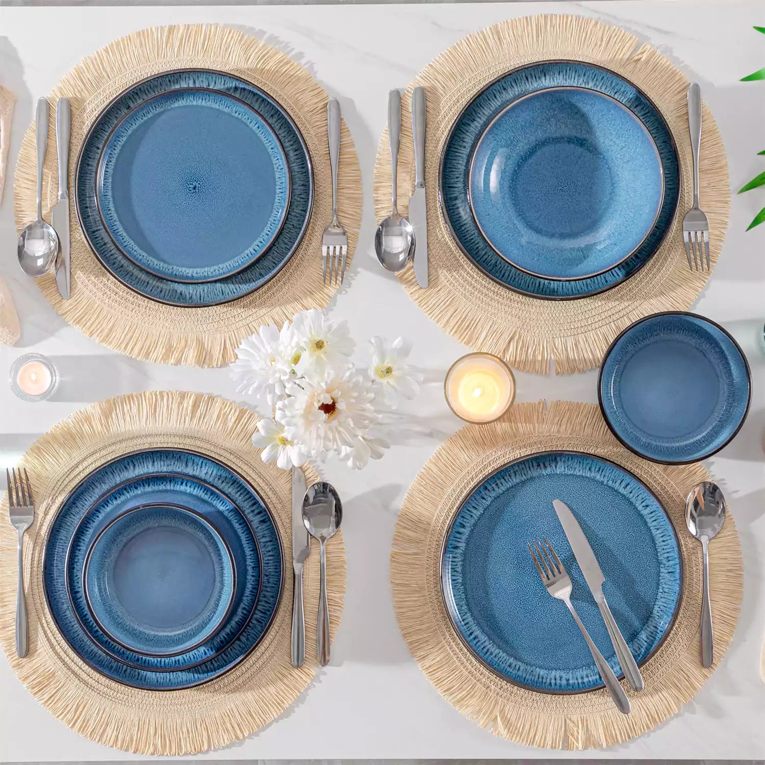 A glossy blue 24-piece stoneware dinnerware set from the Playa collection - featuring farmhouse charm with plates and bowls for 6 people-vancasso