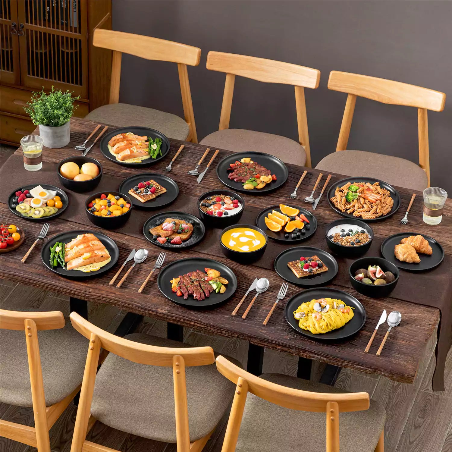 Playa 18-Piece Stoneware Dinnerware Set for 6, featuring plates and bowls in a modern Ibiza-inspired style with a matte black finish-vancasso