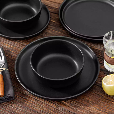 Playa 18-Piece Stoneware Dinnerware Set for 6, featuring plates and bowls in a modern Ibiza-inspired style with a matte black finish-vancasso