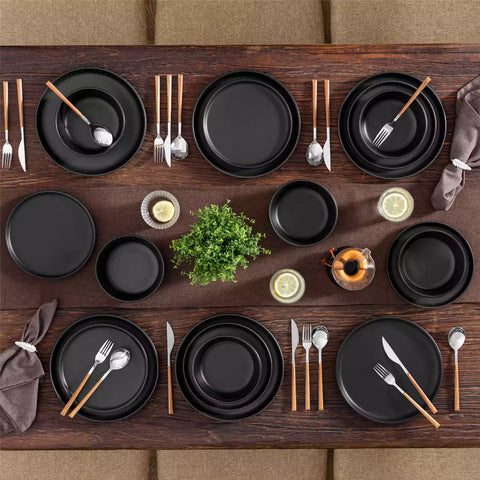 Playa 18-Piece Stoneware Dinnerware Set for 6, featuring plates and bowls in a modern Ibiza-inspired style with a matte black finish-vancasso