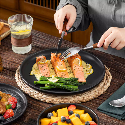 Playa 18-Piece Stoneware Dinnerware Set for 6, featuring plates and bowls in a modern Ibiza-inspired style with a matte black finish-vancasso