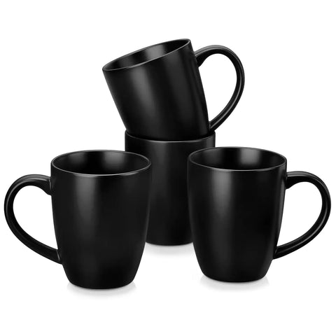 Playa 16oz stoneware mug in black on a rustic wooden kitchen table for a modern breakfast with coffee and fresh fruit