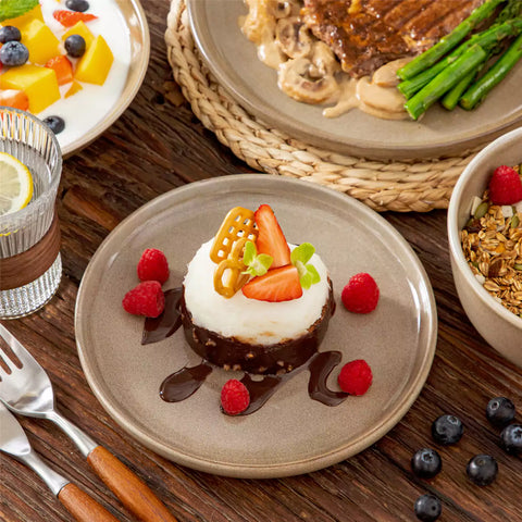 A glossy brown 16-piece stoneware dinnerware set from the Playa collection - featuring farmhouse charm with plates and bowls for 4 people-vancasso