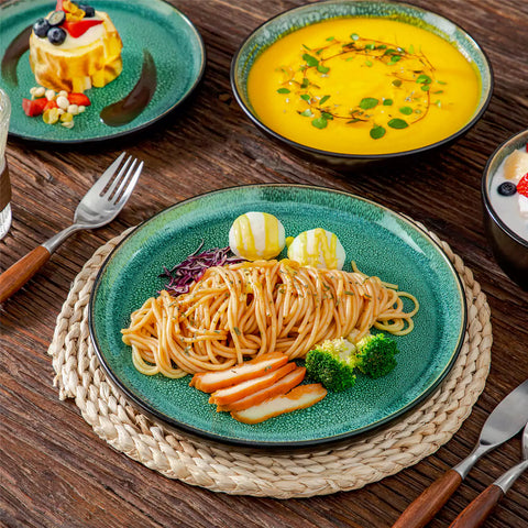 A glossy green 16-piece stoneware dinnerware set from the Playa collection - featuring farmhouse charm with plates and bowls for 4 people-vancasso