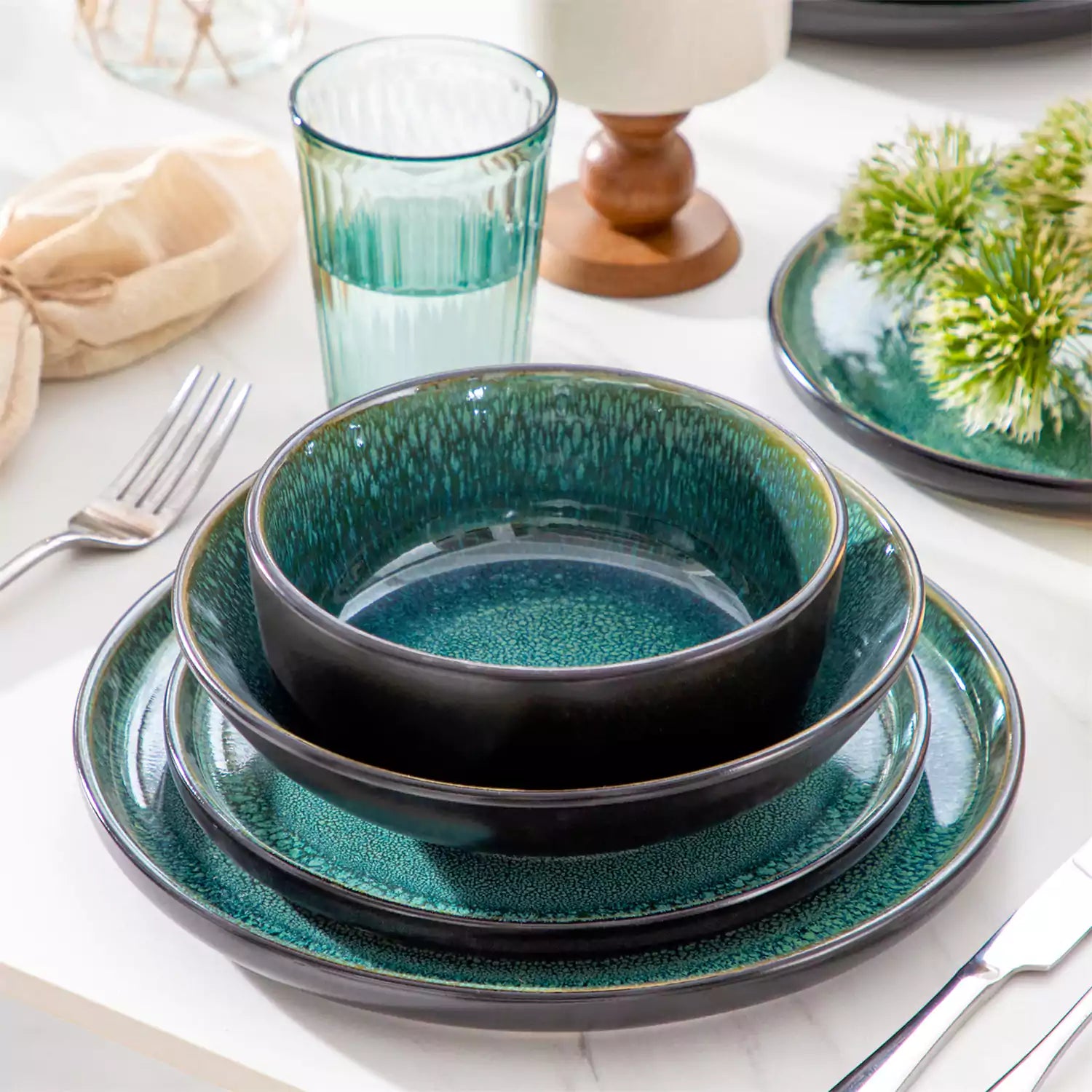 A glossy green 24-piece stoneware dinnerware set from the Playa collection - featuring farmhouse charm with plates and bowls for 6 people-vancasso