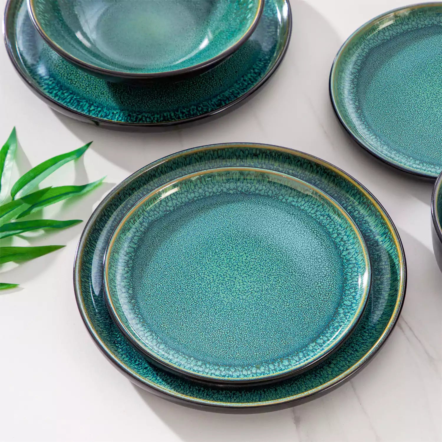 A glossy green 24-piece stoneware dinnerware set from the Playa collection - featuring farmhouse charm with plates and bowls for 6 people-vancasso