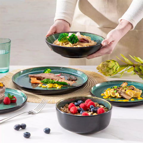 A glossy green 24-piece stoneware dinnerware set from the Playa collection - featuring farmhouse charm with plates and bowls for 6 people-vancasso