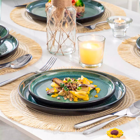 A glossy green 24-piece stoneware dinnerware set from the Playa collection - featuring farmhouse charm with plates and bowls for 6 people-vancasso