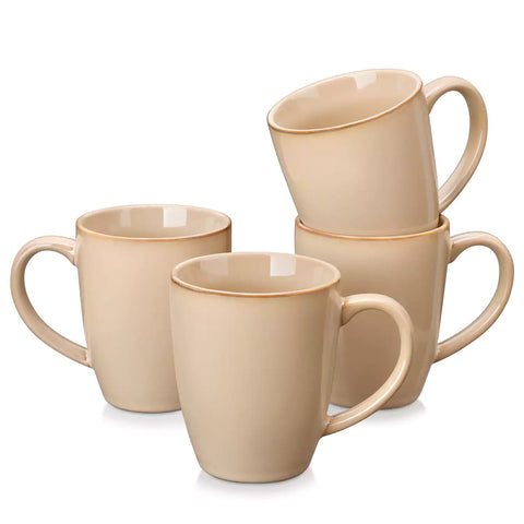 Playa 16oz stoneware mugs in brown reactive glaze on a rustic wooden surface for a cozy morning pour with coffee carafe and scattered beans