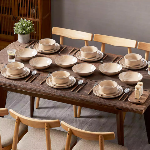 A glossy caramel 24-piece stoneware dinnerware set from the Playa collection - featuring farmhouse charm with plates and bowls for 6 people-vancasso