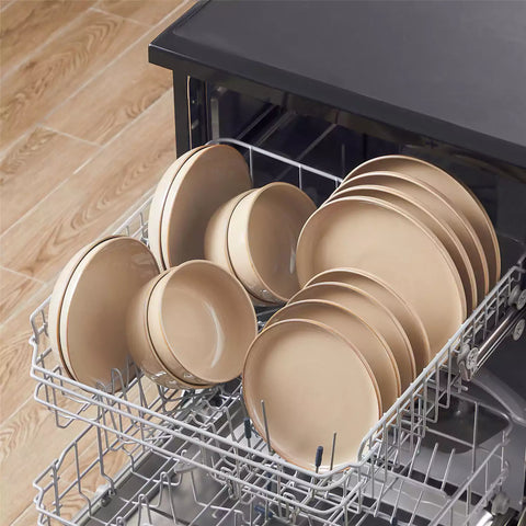 A glossy caramel 24-piece stoneware dinnerware set from the Playa collection - featuring farmhouse charm with plates and bowls for 6 people-vancasso