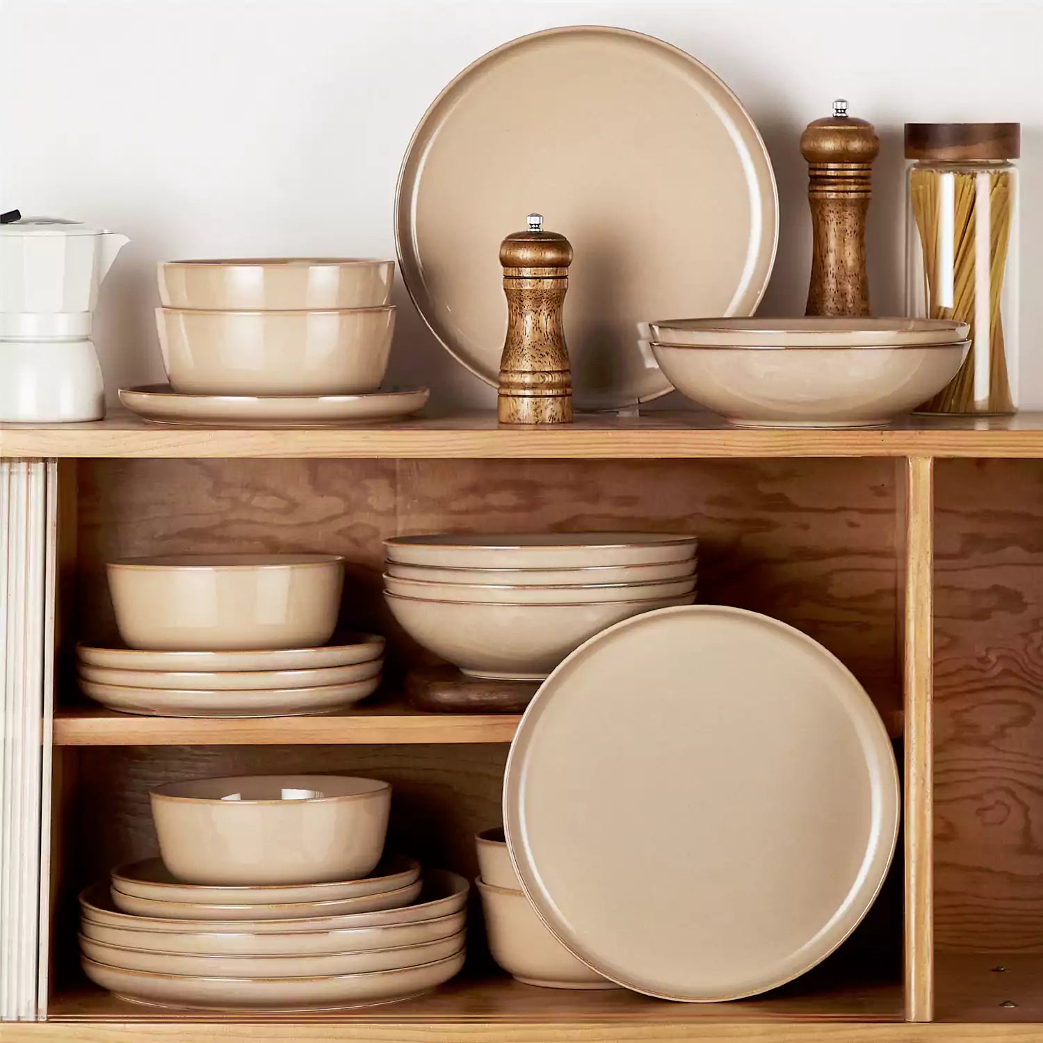 A glossy caramel 24-piece stoneware dinnerware set from the Playa collection - featuring farmhouse charm with plates and bowls for 6 people-vancasso