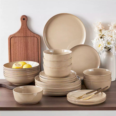 A glossy caramel 24-piece stoneware dinnerware set from the Playa collection - featuring farmhouse charm with plates and bowls for 6 people-vancasso