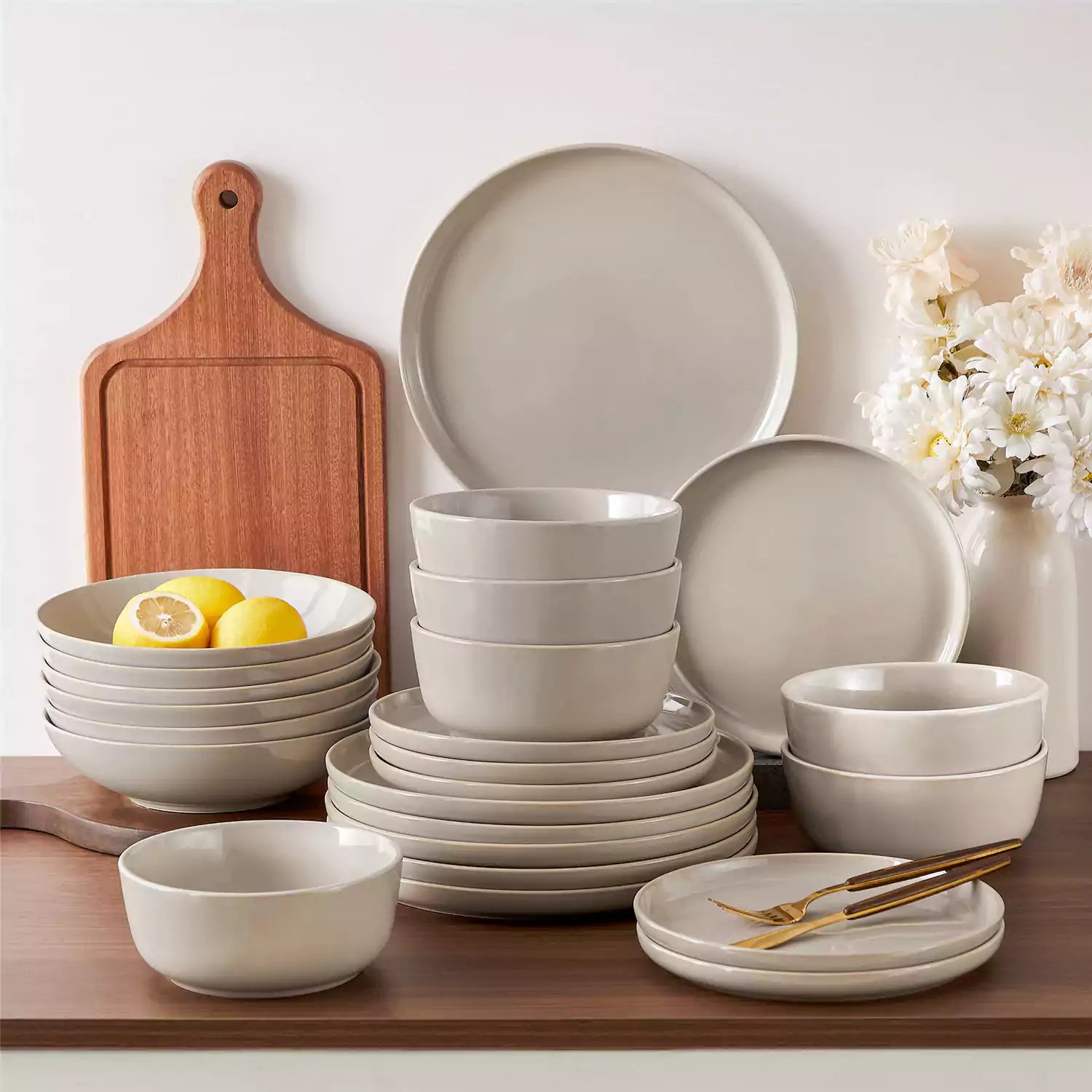 A glossy grey 24-piece stoneware dinnerware set from the Playa collection - featuring farmhouse charm with plates and bowls for 6 people-vancasso
